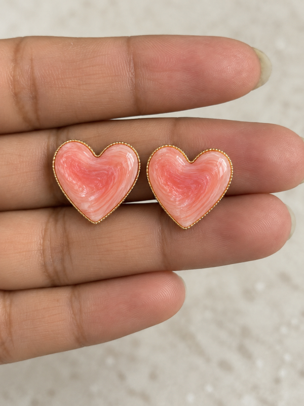 Anti-tarnish heart-shaped stud earrings with pink and white marbled detailing