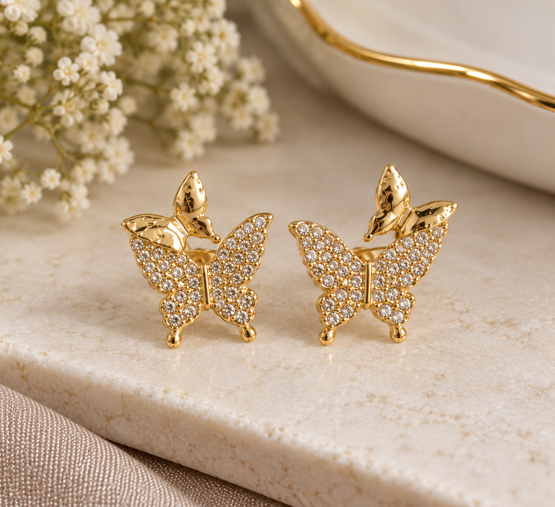 Crystal butterfly statement studs with polished gold-tone detailing