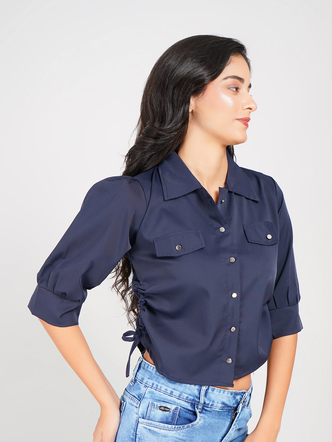 trendy women’s button-down top featuring puff sleeves and tie detail